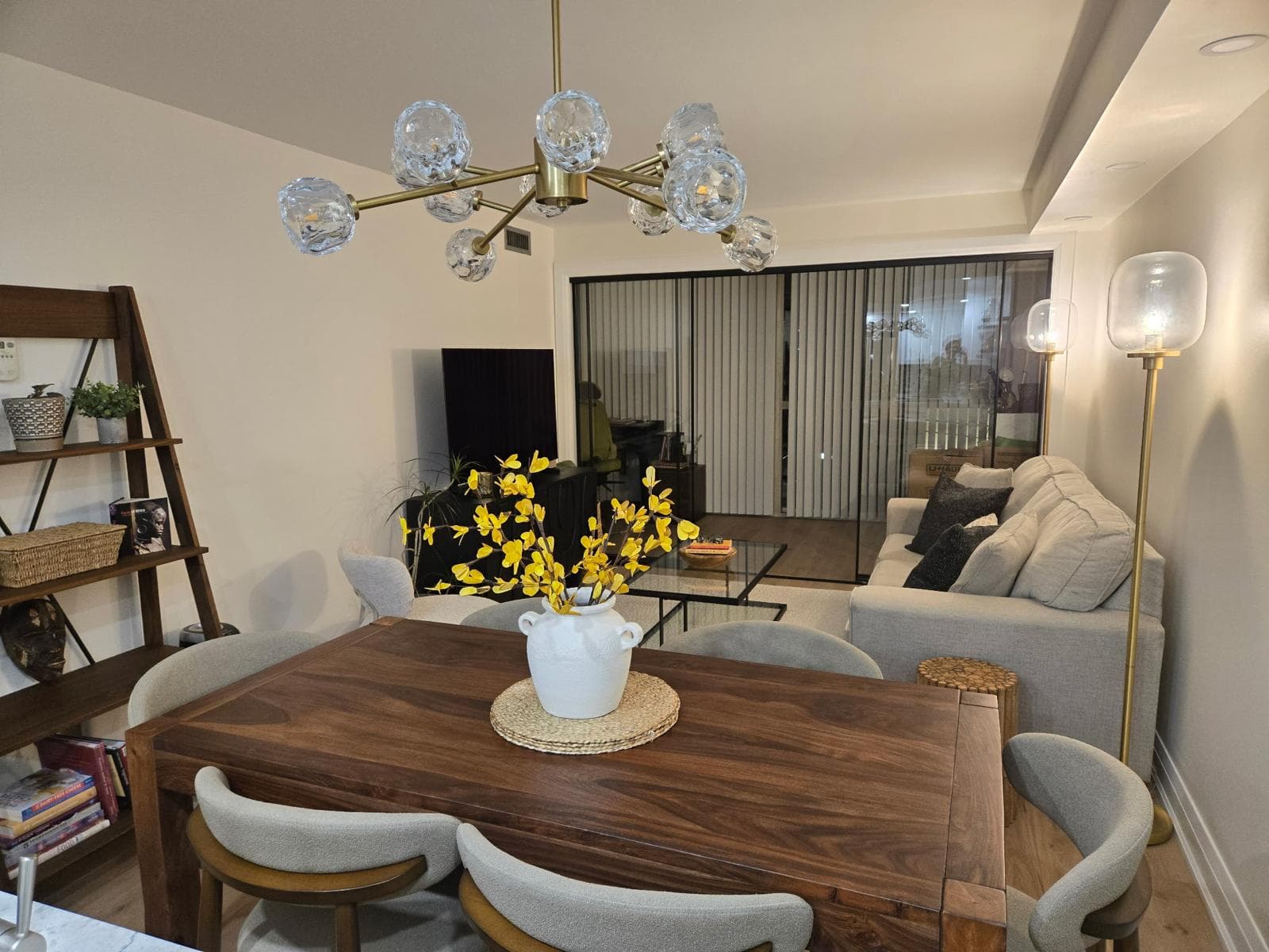 Etobicoke dining area with statement chandelier connected to the kitchen